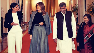 Melania Attempts the Editor Drape